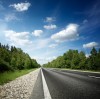 Picture of highway, with trees on the side of the road