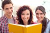 Mon Holding a book with Teenage Children